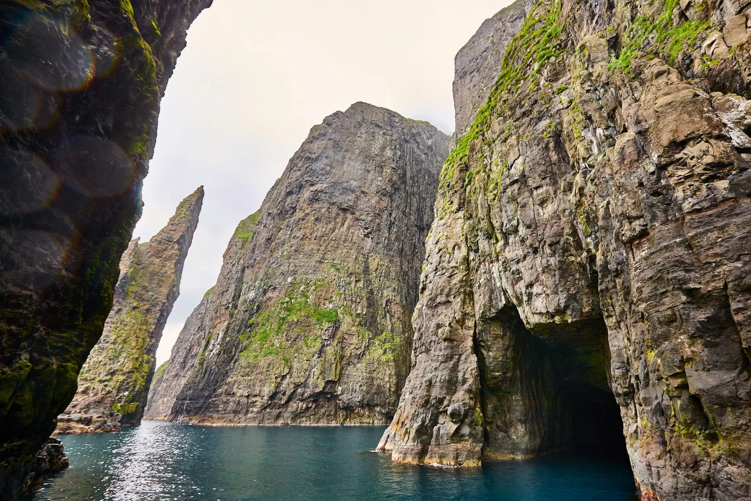 Boat beside the Vestmanna bird cliffs
